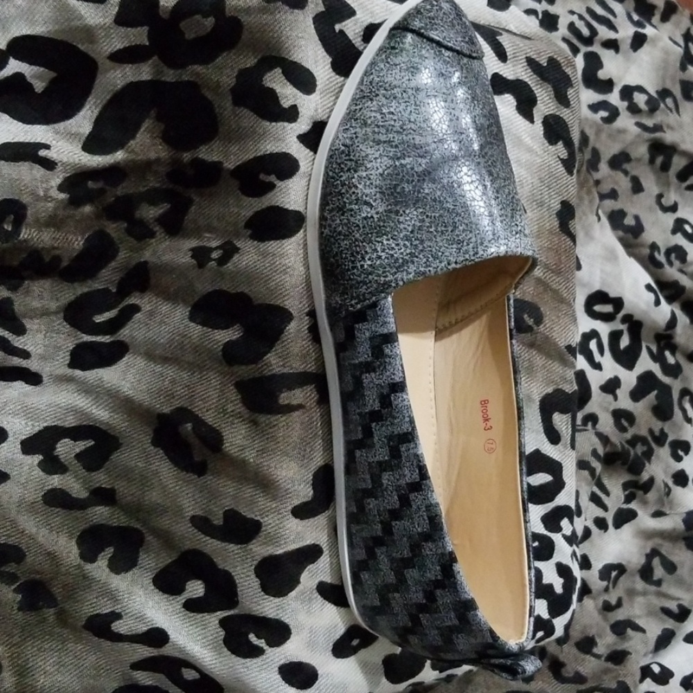 Grey and black slip on shoes